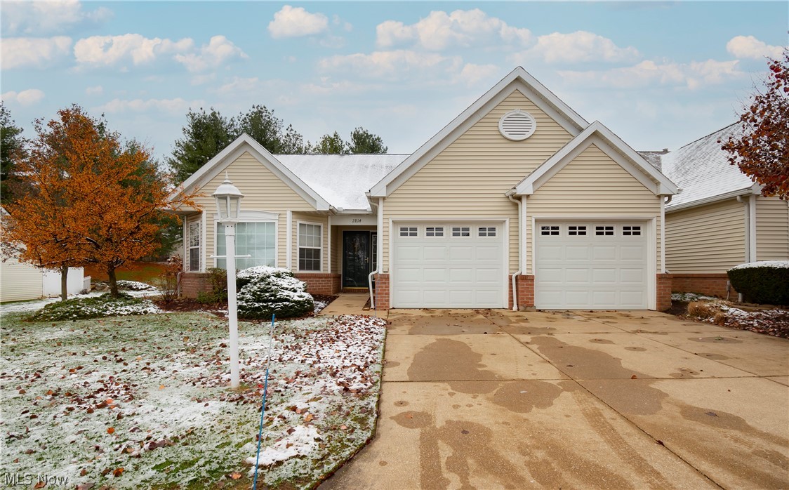 Welcome to 2814 Stratford Circle! This beautiful move-in ready 2 bedroom / 2 bathroom condo boasts a first floor owner's suite, first floor laundry, vaulted ceilings throughout and more. Enter into a large foyer and continue into the fully applianced kitchen with dining area abounding with natural light. The large vaulted great room has a fireplace and room for an additional dining space. The sunroom sits right off the great room granting access to the backyard and patio. Owner's suite includes owner's bathroom with large tub and enormous walk in closet. Your treelined backyard and partially fenced patio will give you just the right amount of privacy you need. 2 car garage with extra storage space. Roof 2020. Dishwasher 2016. HWT, range, fridge, microwave 2015. Don't miss your opportunity! Schedule your private viewing today!