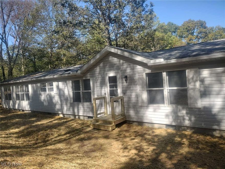 Welcome home to this spacious 3-bedroom, 2-bath doublewide situated on 3 beautiful acres along Argo Road in Crooksville. This property offers the perfect blend of comfort and country charm with a desirable split-bedroom floor plan that provides privacy and functionality. The inviting kitchen features solid oak cabinetry with plenty of storage and workspace, opening to a bright and comfortable living area ideal for relaxing or entertaining. The primary suite includes a full bath and generous closet space, while the additional bedrooms are well-sized and versatile for guests, family, or a home office. Outside, enjoy the peaceful rural setting surrounded by open space and woods —perfect for outdoor activities, gardening, or simply taking in the quiet views of nature. Whether you’re looking for your first home or a quiet retreat, this property has so much to offer!