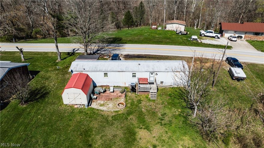 1 Acre of land with utilities on New England Ridge Rd.  This property currently has a 3 bedroom 1 bath mobile home on it that conveys with the​​‌​​​​‌​‌​​​‌‌​​​‌‌‌​​‌​​‌‌​​​​ property.