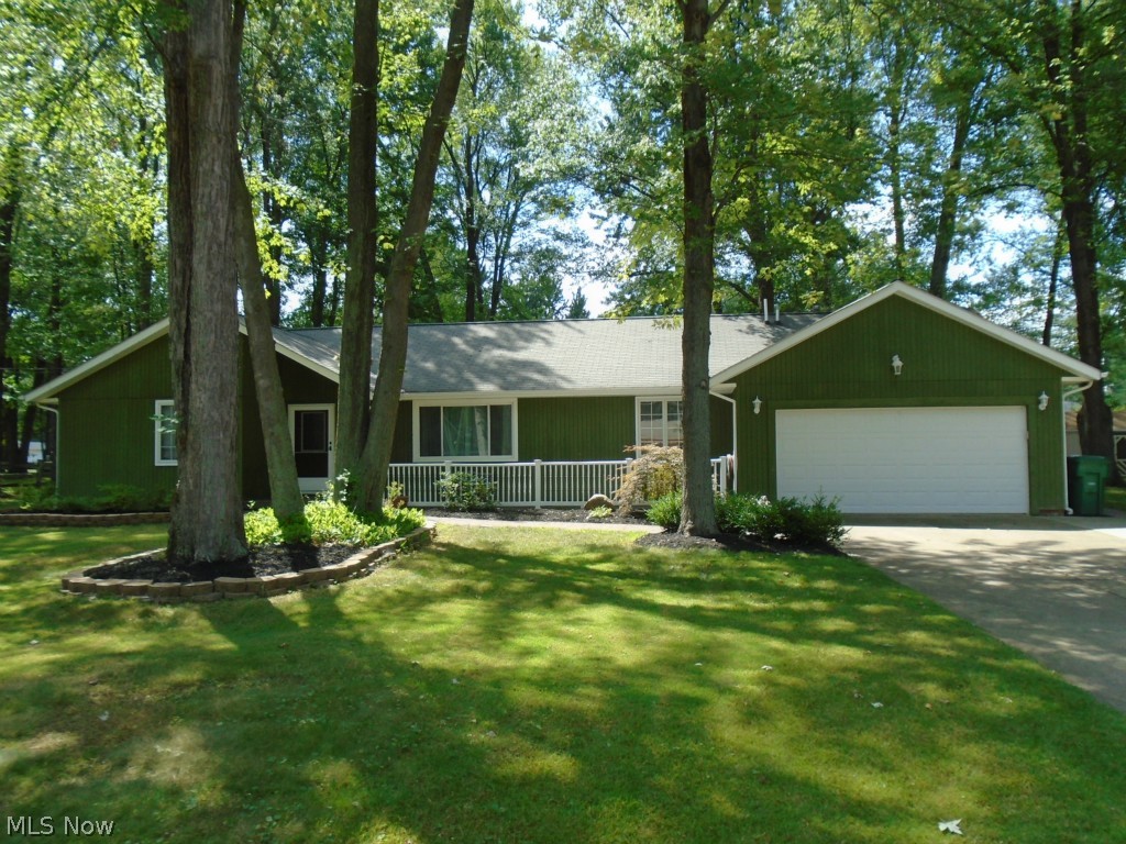 Looking for a meticulous ranch with spacious room sizes; search no more! As you drive down the quiet, mature tree lined street and approach the home you will notice the attractive landscaping, wider driveway with additional added apron, etc. Upon entering the home, you stroll across the pristine carpet in the Living Room with expansive windows for natural light to cascade in. Looking forward to entertaining? Start new traditions under the chandelier lighting in the Dining Room or create an in home office. Open the French doors to the kitchen with spacious center island where you can sit and sip your morning coffee. Kitchen also features newer microwave (2014), garbage disposal (2015), sink (2009) and light fixtures. The Family Room is open to the kitchen and features a fireplace and rear slider to the stunning stamped, colored concrete paver patio. This is the ideal yard for outdoor entertaining which is complete with exterior lighting. Three nice sized bedrooms are located down t