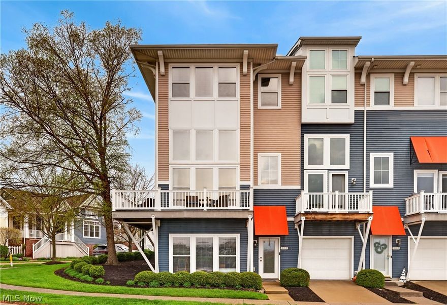 Experience elevated waterfront living in this stunning end-unit townhome located in the highly desirable Harborwalk community. Offering over 2,400 square feet of thoughtfully designed living space, this home showcases beautiful views of the Black River, breathtaking sunsets, and the iconic Charles Berry Bascule Bridge—all just across the street from Lake Erie. Step inside to a bright and welcoming entry-level family room featuring ceramic tile flooring and abundant natural light. The main living level offers an open-concept layout designed for both everyday living and entertaining, highlighted by floor-to-ceiling tinted windows that fill the space with sunlight. Custom motorized shades add both convenience and style, while the gas fireplace creates a warm and inviting focal point. Step out onto the private wrap around deck off the living room—perfect for enjoying morning coffee or evening sunsets and listening to the music across the river. The kitchen is beautifully appointed with granite countertops, custom cabinetry, a built-in buffet with wine storage, center island, stainless steel appliances, and ceramic tile flooring. Balconies at both the front and rear of the home make it easy to enjoy the outdoor setting from multiple vantage points. Upstairs, the spacious primary suite offers a true retreat with room for a king-sized bed, sitting area, walk-in closet, and luxurious four-piece bath. Two additional bedrooms,  full glamour bath, and a convenient laundry room complete the upper level. Additional features include a 2 car attached garage &  access to Harborwalk’s exceptional amenities, including  pool, fitness center & event space. Just moments away, enjoy the newly enhanced stage at Black River Landing—perfect for concerts, events & summer nights along the water. Recent updates include  new roof (2023), ceiling fans (2023), motorized shades (2018), and buffet cabinet (2017). Enjoy the best of waterfront community living—schedule your private showing today.