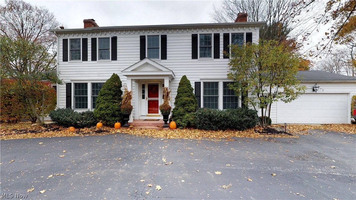 This home is a Spectacular Surprise! Gorgeous Eat-In Kitchen with Oversized Granite topped Island, SS Appliances with Viking Gas Range and Double Ovens, Soft Close Cabinets, Beamed Ceiling, Large Eating Area next to a Brick Fireplace, Windows bringing in Light and overlooking the Courtyard and 2 Tiered Deck with Granite Bar. So many perfect entertaining Spaces – Family Room features Bar Area with Cooper Sink, Ice Maker & Refrigerator, Marble accented Fireplace, and Built In Bookcases. Formal Dining Room has Wall of Cabinets connects to the Enclosed Sun Room and Large Living Room has Crown Molding and Fireplace. Bonus In-Law, Teen Suite, or Private first floor Master Wing has a Library with plumbing in the walls to set the room up as a Kitchen with additional Living Room with Fireplace, Giant Full Bathroom including Laundry Area - Handicap Accessible, and 1st Floor Bedroom with Giant Closet. Foyer has curved Staircase heading up to the Master Suite with dream walk in Closet, Hardwood F