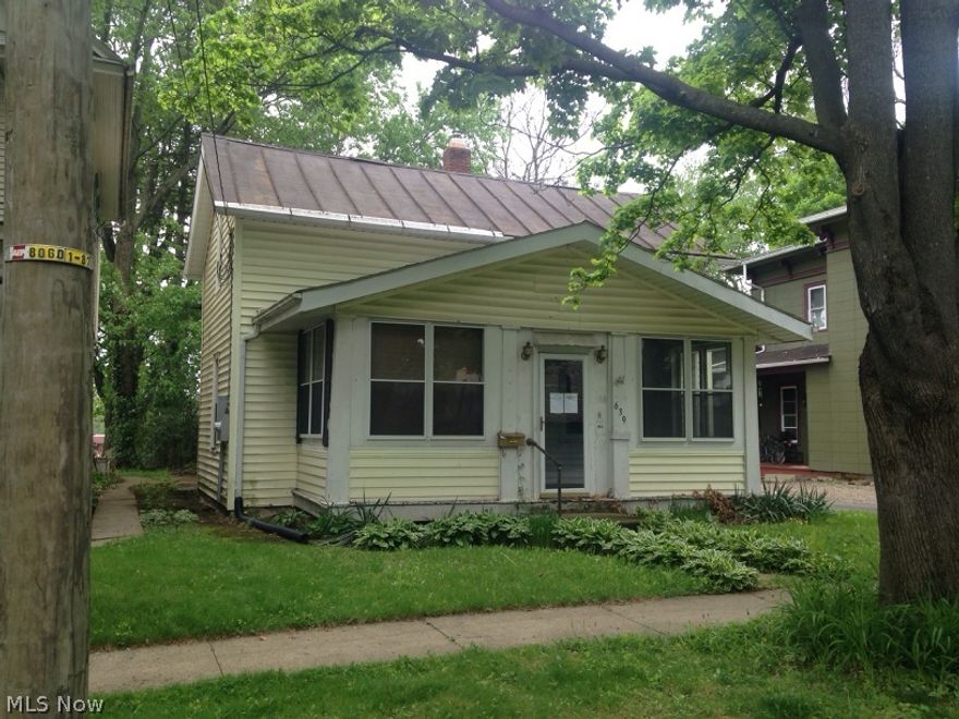 This 3 bedroom, 1 bath bungalow is ready for you to finish with your taste. The main floor has been recently remodeled, but the upstairs needs finished. There is a 2 car garage that needs a roof. Small backyard is fenced in and comes with a playhouse.