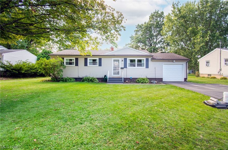 Step into the perfect blend of comfort and charm in this delightful ranch-style home! Boasting 3 spacious bedrooms and 1 large full bath, this home invites you in with its abundance of natural light that fills the beautiful front living room. The stunning, original hardwood floors extend through the living room, hallway, and bedrooms, creating a warm and welcoming atmosphere. Step into the updated kitchen, where modern touches like new flooring, white cabinets, and trendy open shelving harmonize seamlessly. Imagine preparing meals while looking out onto the expansive backyard - a great space that's ideal for relaxation. The lower level offers a versatile finished room, perfect for an office or an additional bedroom to suit your needs. With the basement waterproofing done in 2018, the possibilities are endless for transforming the rest of the space into something truly special. Tons of updates in this home, including a brand new garage door (August 2023), a Hot Water Tank (2023), a back door (2023), and a she-shed in the backyard (2021) - the perfect retreat for hobbies. Essential upgrades such as new windows (2018) and a roof replacement around 2013 and basement waterproofing 2018 ensure peace of mind.