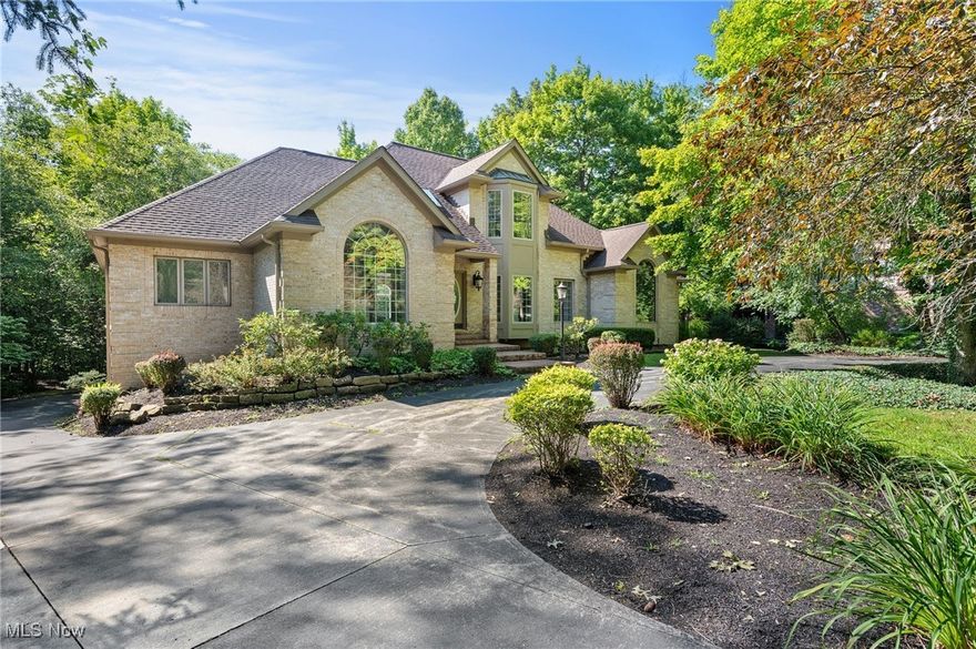 Welcome to this exquisite Brick Colonial situated on over 1.07 acres of picturesque property in the highly desirable Hanover Woods neighborhood. With over 6,958 square feet of living space, this home features a multi-level back deck overlooking the tranquility of the woods and river, 5 spacious bedrooms, a first level primary bedroom, a 2-story great room with classic arched windows that provide a stunning view of the backyard, custom built-in entertainment center, wet bar and a 3-sided gas fireplace, a designated living room with French doors that lead to the office, and a designated dining room. The private owner's suite offers engineered hardwood floors, a walk-in closet and en-suite retreat bath with large soaking tub, roman shower with sitting bench and custom shutter window treatments. The chef's inspired eat-in kitchen, which has been completely updated, features quartz countertops, an oversized custom designed island, under cabinet lighting, tile backsplash, double wall ovens, stainless steel appliances and sliding doors with access to the deck round the tour of the first floor. Upstairs, the balcony overlooks the foyer and great room and you'll find 3, nice-sized bedrooms that all include en-suite baths. The current owners have invested significant time and money making the home the condition it is in today. Some of these updates include: roof and roof heating cables replaced, upstairs/basement furnace and AC replaced, tankless water heater installed, front elevation foundation waterproofing, outside deck stained and painted, kitchen, great room, laundry room, master bedroom and bathroom, all thoroughly and thoughtfully updated, which you need to see to experience...and so much more! A detailed list of improvements can be provided. INCLUDED are all stainless steel appliances and washer/dryer. Conveniently located near I-271, shopping, restaurants, parks, and other local attractions. Call today to schedule your private tour before this one is gone!