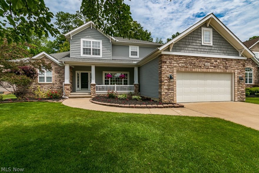 Welcome to this pristine 3 bedroom, 2 1/2 bath colonial in the desired Woodlands Development on a cul-de-sac street. The foyer welcomes you with hardwood floors into the dining room with a lighted trey ceiling and plenty of space for entertaining. Open floor plan with a two story (19ft) great room with stunning custom windows surrounding a cozy gas fireplace. The eat-in kitchen features bar-top seating, all stainless steal appliances, a large pantry and transom windows. First floor master suite with a walk-in closet, transom windows, and an updated (2018) master bath with tile surround shower with marble floors, soaker tub and a linen closet. Upstairs you will find a loft area and two nice-sized bedrooms, both with double closets & organizers, and an additional full bath. Partially finished lower level with recreation room, utility room and plenty of storage space. Walk out the glass sliding door to the brick paver patio in a wooded and beautifully landscaped private backyard with spri