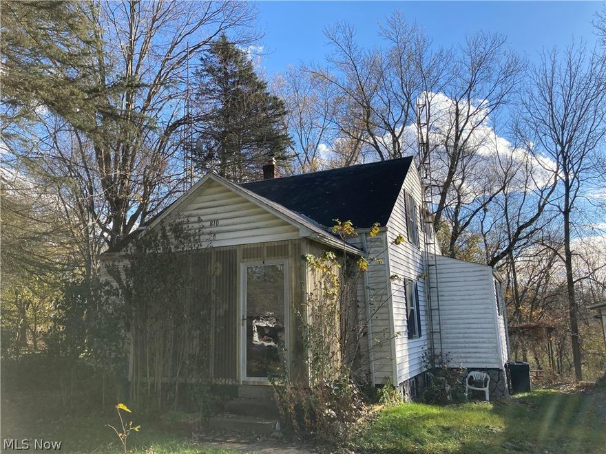 Welcome home to this 3 bedroom 2 bath bungalow.  Situated on 2 parcels, this is an amazing opportunity on the southeast side of Canton. Convenient location, 1.5 miles to the highway. Private setting with lots of potential. Hardwood floors under the carpet on the main level, tons of natural light throughout, and newer refrigerator. Primary bedroom with attached bath on the main floor, 2 additional bedrooms AND a full bath on second floor. Enclosed front porch and a back patio will leave you with plenty of outdoor entertaining space.