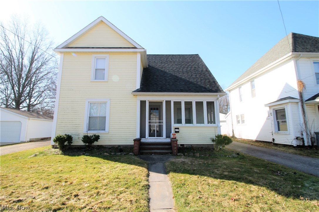 Welcome to this charming updated colonial home. Come on in from the enclosed porch from sitting outside and enjoying the fresh air. The home has been freshly painted and offers a large living room, dining room, kitchen offering wood floors and wood trim, office and or bedroom, laundry room and half bath with new toilet, laminate floors, all on the main level. The kitchen has new counters, tons of cabinets, refrigerator, stove, dishwasher and window above the sink offering natural light to shine through. Upstairs you have two large bedrooms, and a full bathroom. The fenced in backyard offers so much more outside room to entertain and to just relax. There is a two car detached garage. WOW! Precious memories begin right here at home!