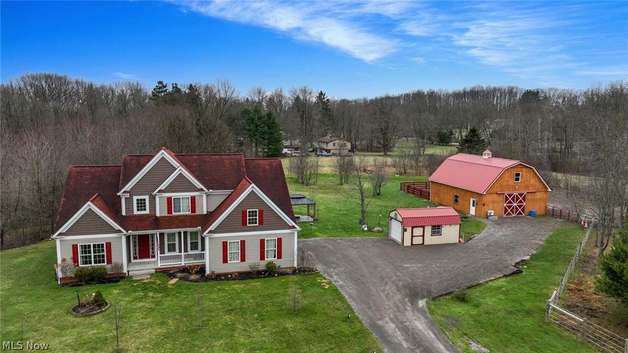 PRICE IMPROVEMENT — This stunning 2015-built Contemporary Colonial sits on 4.12 acres.  The grand, open two-story entrance creates an impressive welcome, leading into a spacious great room with a wall of windows and a gas fireplace —perfect for relaxing or entertaining guests.  The kitchen features stainless-steel appliances, a pantry, granite countertops, and a breakfast bar.  The morning room connects to the kitchen and great room and features a sliding door to the yard.  Powder room and a full walk-in closet off the hallway from the entrance.  The side-entry 2-car garage provides easy access to the 1st-floor laundry room.  The Primary Bedroom features a gas fireplace with double vanity sinks, a water closet, a private all-title shower, and a full walk-in closet. The Loft overlooks the stunning Great Room with a Wall of windows.  The lower level is a walk-up basement, with lots of storage and unfinished space.  Additional living space is set up as an in-law suite with an open kitchen design, a bedroom, a full bath, and a walk-in closet. Great for the help with the horses. The property includes a 40x32 barn with 2-horse stalls, 12x12 ft, a window in each, and water and electricity. The spacious Loft features an expansive storage area and a finished 24 x 14 room with wood laminate flooring, which can be used as an office, and heat & A/C, with storage under the stairs. The first paddock has 3 gates that can open into three separate areas, totaling about 2100 linear feet. A second storage shed, 16 x 10, for additional lawn equipment. The one-acre paddock is east of the house. The gazebo is located on a decorative concrete area. Decorate lighting.  The back east side of the property has a great rustic timber frame she-shed to get away from it all, decorated with all LVT flooring, 2-24 x 38 windows, and a 4x10’ loft for overhead storage, heat, and a/c. The furniture and the mailbox do not convey