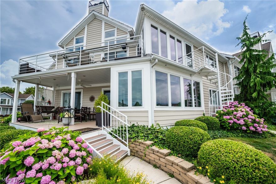 Looking for waterfront property? This is one to see! This completely updated condo is in the luxurious Island Villas in the Harbor. This 2 bedroom 2 bathroom home is in a prime location! In addition to all of the beautiful updates in this home, it comes with a garage. With very few garages available in The Harbor, it is a great bonus! Beautiful, fully enclosed sunroom which leads to the patio and has amazing views of the water. The patio is a great space to relax and enjoy all the beauty this property has.  Just off the patio you have your boat dock and you also have extra dock space so you are able to fit a boat and water toys, multiple boats, etc. Most homes in The Harbor only have one space so the extra space on the dock is another great feature. Furniture included is the dining room table, both bedroom sets, and both curio cabinets. Gated community, 2 swimming pools, clubhouse, tennis courts, and more! With all the upgrades, the prime location, and bonus add ons, this property is o