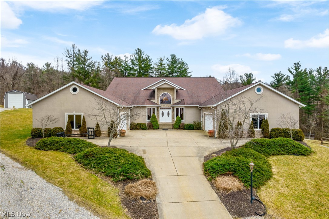 BACK ON THE MARKET due to no fault of the seller or the property. The buyer was not able to preform and close. A rare opportunity to purchase this stately custom-built 2 story home with 5000+ square feet of living space that boasts 5 bedrooms (first floor owner's suite), 3-1/2 bathrooms, 4 car attached garages, 45x18 outbuilding with loft, two fenced pasture fields, and 4 private acres backing to woods! Did I mention the huge rear covered patio with an outdoor fountain and firepit? Did I mention the 17x12 owner's suite closet? This is a very special property! You won't be disappointed!