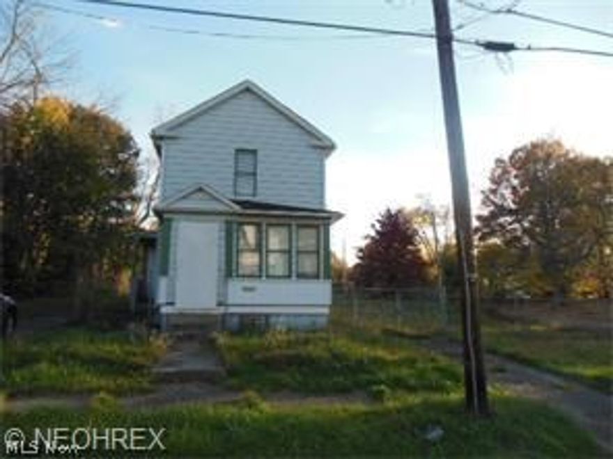 Live in the Country, in the City! This home is all by itself, not many neighborhoods, quiet and fenced in yard. Home needs some work but the price is GREAT!. City water and City sewer. Gas, Electric even cable! Owner will not do any repairs to home but you receive Free and clear title, with taxes paid Too. Some newer Homes near there. 2 big bedrooms upstairs, living room , dining room and kitchen full basement was waterproofed  along time ago. No paperwork available on it.