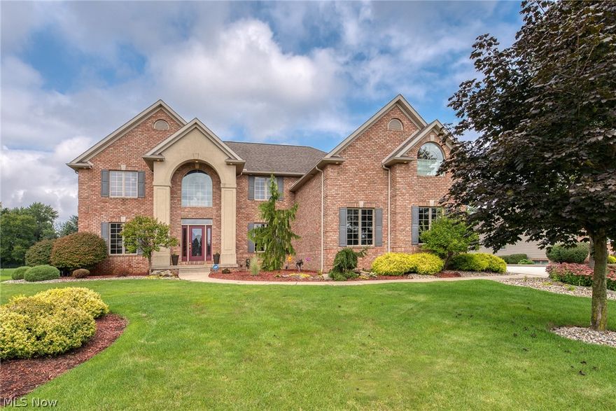 One-owner custom home in a golf course community! This architectural two-story boasts 5,000 square feet of living space with 5 bedrooms. The first floor has a huge two-story great room with stone floor to ceiling fireplace and Pella windows accented by poplar trim. As you walk into the gourmet kitchen, it is loaded with high-end features such as granite counter tops, cherry cabinets, double oven, island with cook top, vented hood, breakfast bar, wet bar, stainless appliances, wood floors, desk, and tile backsplash. The first floor is completed by a formal dining room with detailed tray ceiling, an office / study sealed by glass french doors, vaulted ceilings in the foyer, cast iron staircase, mudroom, and complete home audio system. The spacious second level master is grand in features like two walk-in closets, enormous tile / glass shower, jetted tub, ceramic tile heated floors, and two vanities. The second floor has a guest bedroom with private bathroom ensuite, two more bedrooms, ba