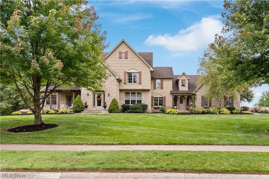Welcome to this custom-built home in Jackson Township in the prestigious Carrington development, this home boasts a remarkable 6000+ sq ft of living space, including 5 bedrooms, and a plethora of luxury amenities. A grand hardwood foyer welcomes you into a home designed with elegance and comfort in mind. The first floor features a formal dining room with an open concept, alongside a versatile library/music room/den leading to a living room with a gas fireplace. The chef's kitchen is equipped with Cherry Mullet Cabinets, granite countertops, a prep sink, and top-of-the-line appliances, complemented by a hearth room with an additional fireplace. A 4-season sunroom and walk-out deck with covered awning enhance the living experience.  The second floor hosts a spacious primary bedroom complete with a luxurious bathroom featuring dual vessel bowl vanity sinks, a soaking tub, a large shower, and a substantial walk-in closet. Additional bedrooms include large closets and one with a full junior suite.  The second floor includes 3 bathrooms.  The walk-out basement opens to a serene park-like backyard with brick pavement and a calming waterfall. It houses a stunning bar, pool table, recreation area with fireplace, an extra bedroom with a bathroom, and a deluxe theatre room, adding to the home's allure. Additional Features: Over 6000 sq ft of living space, 3-car garage, Deluxe first-floor laundry, Dual staircase, Anderson Windows, Proximity to Carrington walking path, two furnaces and zoned heating, roughed central vac, two large hot water tanks, public water and public sewer.   Close to Jackson Parks and schools.
