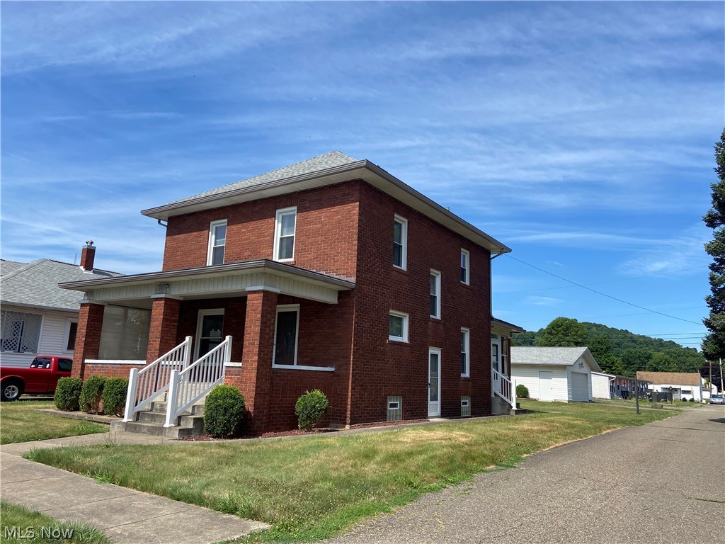 Nice convenient south side location. This well maintained brick two story has been beautifully maintained for many years by the same owner. Features include: Living room open through french doors into a formal dining room. The cozy kitchen comes with range & refrigerator. There is a first floor bedroom with 1/2 bath. This could also be a nice office space, play room or just an extra room to relax. Near the first floor bedroom is an additional staircase to the second floor.
The living room has an open staircase with rich wood panels that blend well with all of the natural woodwork. The 3 large bedrooms have good closet storage. A walk in shower with glass doors, high profile toilet & vanity make up a very spacious bathroom along with additional linen storage in the hallway. Don't overlook the nearly new dimensional shingle roof, soffit, gutters and downspouts, replacement windows, updated bathroom, furnace and central air. The seller is unsure if there is hardwood under the carpets. Laundry is already set to go with an updated washer & dryer that is included. Nice deep basement, glass block windows, breaker box, outside & inside entrance.
Enclosed back porch. Nice grassy area lot with a 23 x 24 garage, blt 1984, Like new outside& inside/concrete floor/opener/concrete parking pad. This house is a must see. Very nice & clean. Make it your own. Priced to sell. Estate sale- sells "as is".