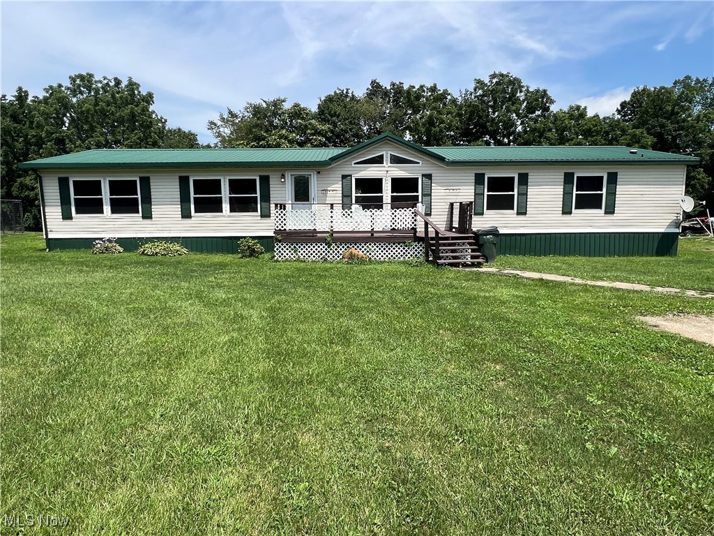Welcome to your peaceful country retreat! This 4-bedroom, 3-bath manufactured home offers the perfect blend of comfort, space, and rural charm. Nestled on just over 6 acres of picturesque land, this property provides plenty of room to roam, garden, or simply enjoy the outdoors in privacy. Inside, you’ll find a bright and open floor plan with a generous living area, a large kitchen with and a cozy dining area—ideal for family gatherings and entertaining. This home has 2 decks plus a 31 X 23 detached garage with a concrete floor. The breaker panel, hot water tank, and furnace have been replaced plus the windows were updated last year. The efficient auxiliary pellet stove heat source is less than 2 years old. Improved walk in showers are a helpful addition in 2 of the 3 bathrooms.