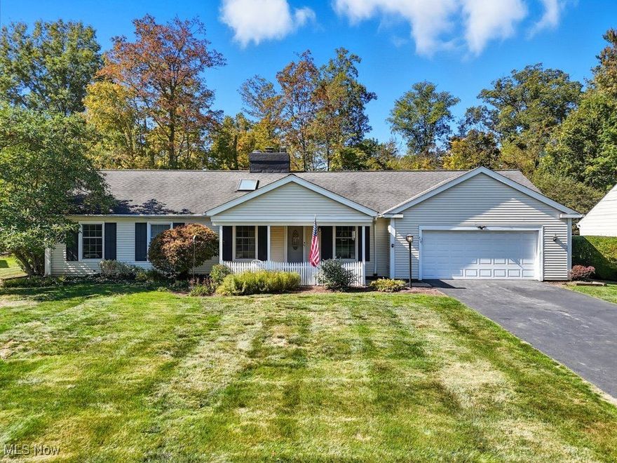 Welcome to this well-kept and charming ranch in the heart of Mayfield Village, tucked away in a peaceful neighborhood yet just minutes from restaurants, grocery stores, and shopping. This delightful three-bedroom, 1.5-bath home offers both comfort and convenience with a spacious, easy one-floor design. Step inside from the covered front porch to a welcoming foyer that flows into a bright, well-sized kitchen with a cozy dining nook filled with natural light. The kitchen opens to family room featuring high ceilings, wood-burning fireplace with brick surround and wall of windows overlooking the backyard. A bonus four-season room with sliding doors provides the perfect spot to relax, entertain, or enjoy views of every season. The opposite wing of the home features three comfortable bedrooms with fresh paint and hardwood floors, plus a stylishly updated bath with a walk-in shower and new tile. There is also an additional laundry hookup available in the third bedroom. The lower level offers abundant storage and potential for additional flex space. Outdoors, the oversized backyard is shaded with mature trees, creating a peaceful setting to enjoy year-round. Meticulously maintained and filled with natural charm, this ranch is the perfect combination of cozy character and smart updates—an opportunity not to be missed in Mayfield Village!