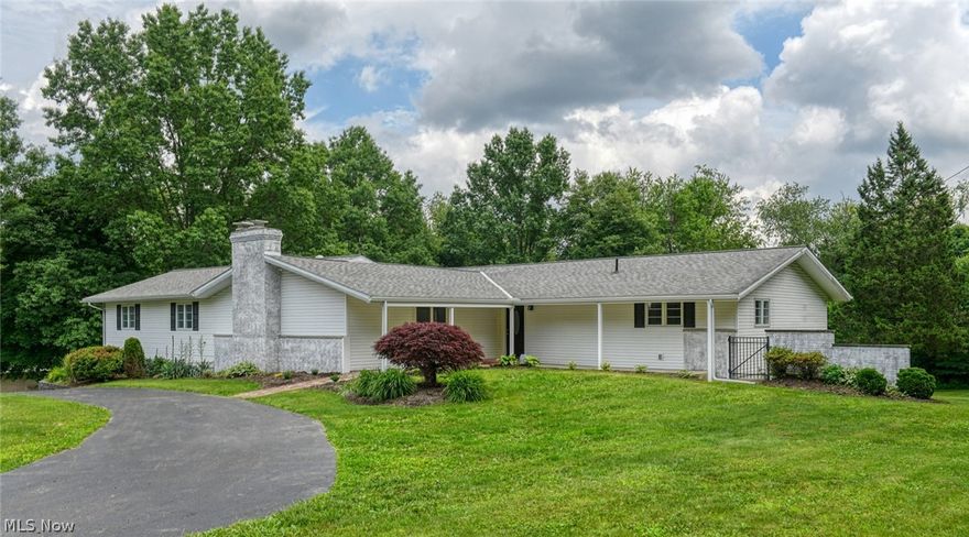 Open and spacious ranch completely remodeled. Large kitchen great room with white cabinets,island w bar stool area - granite, all new stainless steel appliances. Large great room flows from kitchen. Great room with slider to deck. Also spacious living room with brick fireplace, wet bar . All this area has engineered floors. Master suite with 2 walk in  closets and remodeled bath with large tiled shower . The other 3 bedrooms are off the living room in a separate suite. The children's bath is also remodeled. All bedrooms have fresh paint and new carpet!. First floor with with almost 2900 sq ft plus walk out lower level with additional 1000, total sq ft approximately 3850. Lower walk out level with large rec room, full bath and additional space could be work out area. 2 car garage attached  plus- 2 outbuildings - one 40x 24 with a loft and 220 power ,second outbuilding 22.5x18.5.