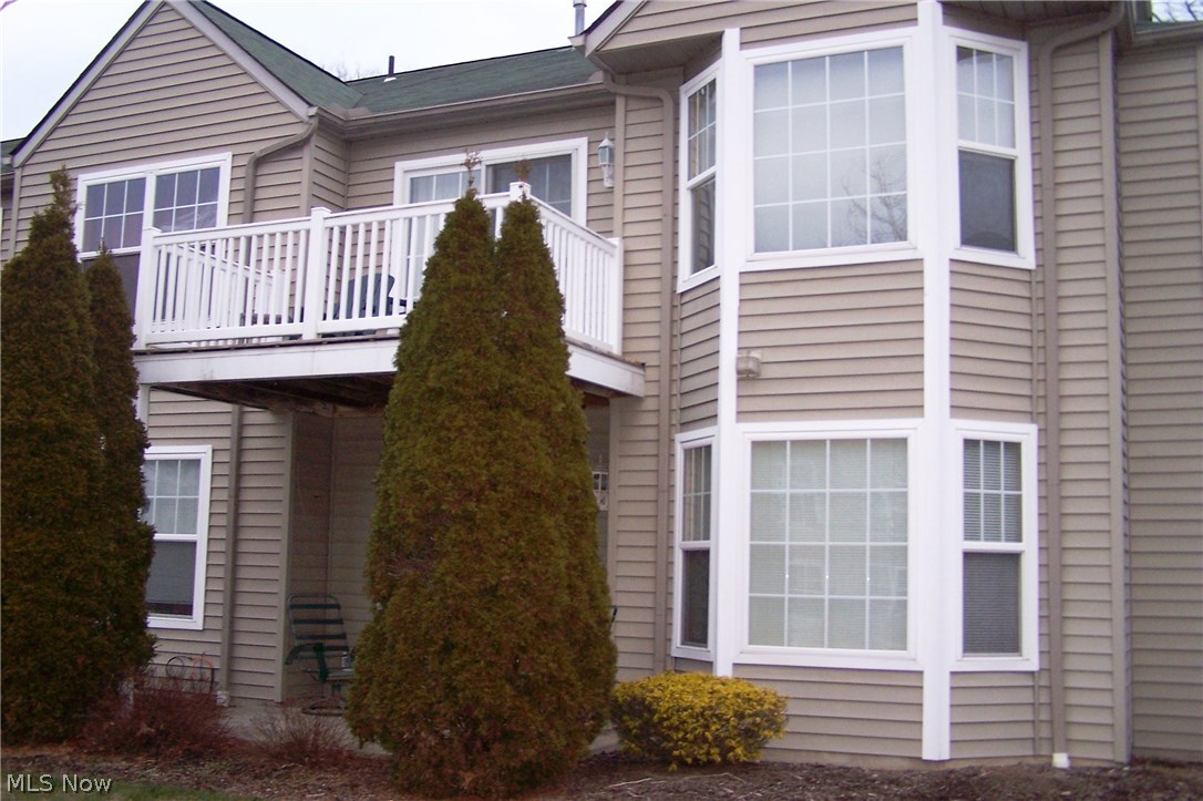 Downsizing or just a new chapter in your life? Enjoy a wonderful condo lifestyle in Sagamore Hills! Residents have access to the Exercise Room, Tennis Courts, 2 Swimming Pools (1 indoor & 1 outdoor). You'll also appreciate coming home and pulling into your 2 car Garage then coming right into the building without enduring the elements (before going to the second floor to your unit). Entertain your guests in the lovely decorated Living Room with a Gas Fireplace in the Living Room or spill into the dining Room for a nice dinner. Whether cooking a simple meal, setting up a buffet or creating a gourmet dinner, you'll be able to converse with your guests in the Cute Galley Kitchen with appliances (brand-new refrigerator, range, microwave, dishwasher and garbage disposal) via the window-type opening to the Dining Room area. A few steps away, your guests would have access to a full bathroom (sink/vanity, tub/shower and toilet. Or enjoy the balcony deck during those warm balmy evenings. Owner's suite includes expansive closet and full bath (tub, shower, sink/vanity and toilet). Second bedroom with nice size closet can used for a family member a guest or perhaps a home office. This unit also includes a Laundry Room (washer and dryer included). Don't wait! Call today for your private showing.