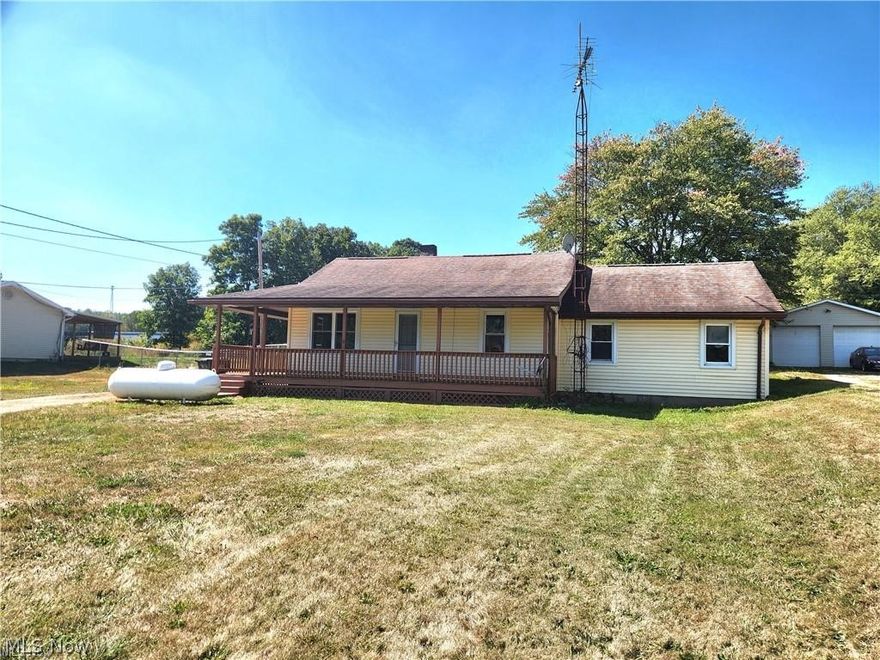 Welcome to this updated 3-bedroom ranch in the highly sought-after Sandy Valley School District! This move-in ready home offers brand-new flooring, updated electric, newer windows, a newer furnace, wrap-around porch that is perfect for relaxing and fresh paint throughout. Sitting on nearly half an acre, the property also includes an oversized shed—perfect for storage, hobbies, or all your outdoor toys. There is also an additional living space just in case you need to spread out!