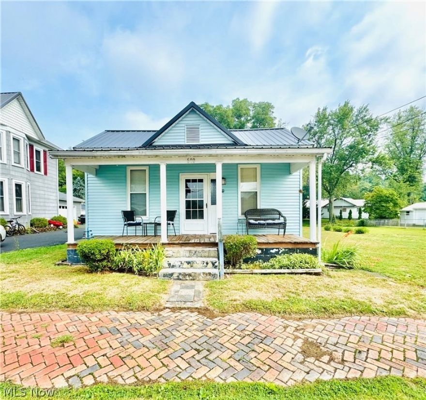 Welcome to this charming 2 bedroom home, perfect for those seeking comfort and simplicity. This home features an open-concept living area and kitchen, creating a seamless flow that's ideal for everyday living and entertaining. The kitchen features modern appliances that convey with the house and a touchless sink faucet. Enjoy the benefits of many updates, including a durable metal roof, vinyl windows, hot water heater, and forced air furnace, ensuring both energy efficiency and long-term value. Outside, you’ll find a nice sized level yard, perfect for gardening, animals, or simply relaxing in the fresh air. You'll enjoy both the front and back covered porches as well. Whether you’re entertaining guests or enjoying a quiet afternoon, this outdoor space provides a versatile setting for all your needs.