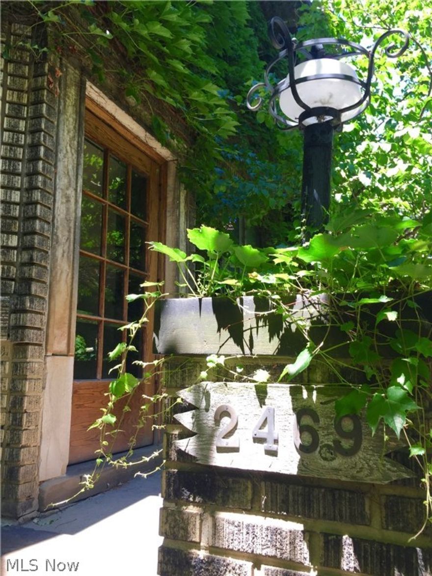 Live in your very own French Secret Garden...in Cleveland Heights!  A sought after design style...modern flare meets european charm.  Honestly, you will be taken aback by the majestic landscaping and serene courtyard at this fairy tale like condo.  Enter into the living room space with on-trend paint and modern light fixtures.  One wall of the living room space offers loads of natural light with french windows and doors which open up to a Juliet balcony showcasing the lush greenery that acts as a natural barrier to your neighbors. The dining room is large and could possibly be converted to a 2nd bedroom OR keep it as is and use the original murphy bed for your guests, which is hidden behind a luxurious large wooden turn-style door!!  Tons of storage including deep bedroom closet, built-in original vintage dresser behind murphy-bed, plus your own secured storage unit in the shared basement.  In-suite laundry off full-bath.  The kitchen has been updated with granite counter tops and stai