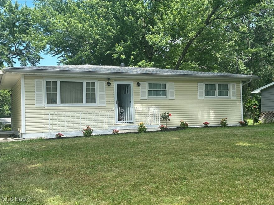Inviting Ranch on a Spacious Lot – Discover this well-maintained 3-bedroom, 2-bath home on a generous 0.34-acre lot in Akron. The bright living room and updated eat-in kitchen provide comfortable everyday spaces. A full unfinished basement offers excellent storage or finishing potential, and the carport with concrete drive adds convenient parking. Enjoy the easy access to shopping, dining, and major highways for a quick commute. Move-in ready and ready for your personal touch!