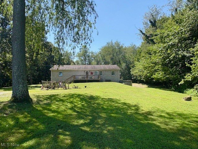 REDUCED!! On This Almost 2 acres with wrap around drive for more parking than needed and woods on sides and back of Home... Call this as YOUR Home in this Open concept with spacious 4 Bedrooms and 2 Full Bathrooms with Laundry on main floor and all updated throughout. Each room is comfortable in size with newer flooring, painted walls and more. One of the Full Bathrooms has a jacuzzi/shower combo with both plenty of storage. Appreciate the large open Kitchen with stainless steel appliances, plenty of countertop and storage. Make this Large Basement of your wants/needs connected into an over extended 2 bay+ Car Garage. Enjoy the outside from the large front Deck or extra large back Deck connected to a brick patio too. The woods on the sides and back gives privacy to the back deck/patio and yard. Septic however Public Water (Buckeye Water). Call Today to Schedule.