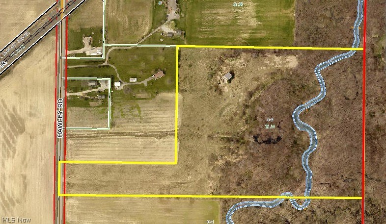 Twenty-six acre parcel with approx. 16in acres of woods at the rear. Creek runs across rear of property. Gravel drive leads to private setting with outbuilding with lean to and concrete pad. Private setting to build your home and enjoy nature, hike, hunt, and more. Property in 100 year flood zone. Lorain County easement for drainage ditch across a portion of property to creek. Property is just South of 20355 Hawley Road.