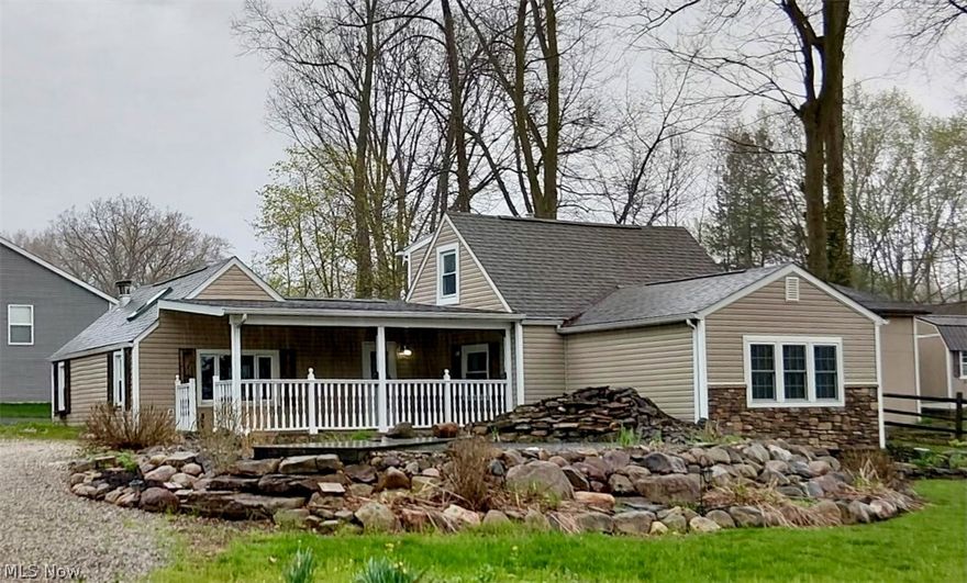 549 Perry Road, Tallmadge, Ohio 44278. Welcome to a thoughtfully updated home that blends comfort, functionality, and standout outdoor features. Inside, you’ll find a refreshed interior with all three bedrooms newly recarpeted.  Major updates include a second full bathroom with a walk-in shower and double sinks off the primary bedroom. The home also features a ground-floor laundry room and mudroom, adding everyday practicality and organization right where you need it most. Peace of mind comes with a brand-new roof, updated electrical panel box, and new furnace. The fenced-in side/backyard provides privacy and space for pets, play, or entertaining. A picturesque koi pond with a cascading waterfall serves as a stunning focal point. The large detached garage offers exceptional versatility-ideal as a workshop, hobby space, or car storage or high lift area for working on automobiles. Ample parking in the pull-through driveway ensures plenty of room for guests, equipment, or multiple vehicles. This property offers a rare combination of meaningful updates, usable space, and unique outdoor charm—with Tallmadge schools and close access to Interstate 76.