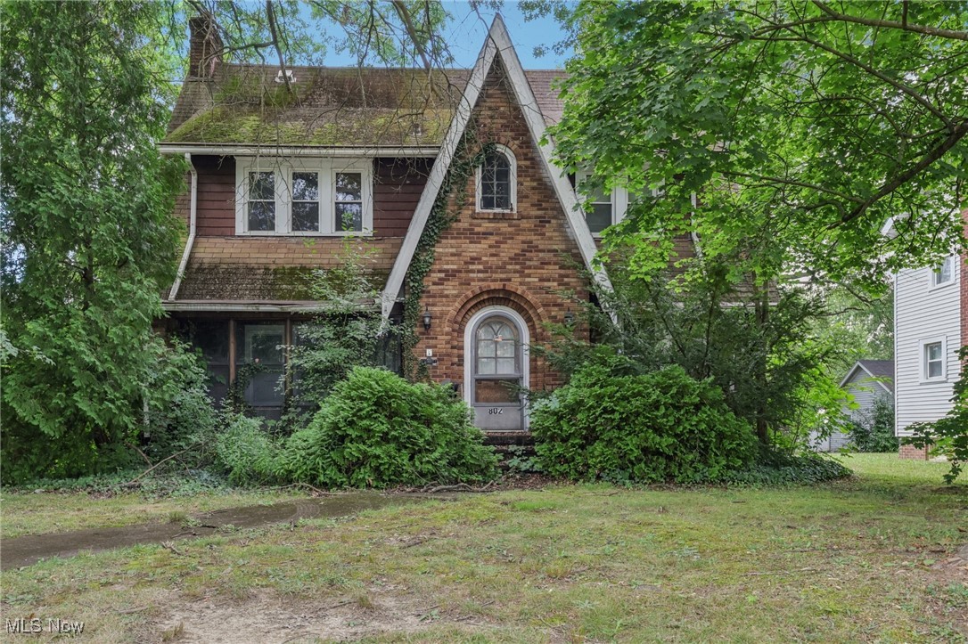 This colonial brick house is just a step away from being brought back to it's glory. The 1931 house has very nostalgic features. With original woodwork, brick fireplace and center grand staircase...you can just envision the beauty it once had and can have again. A porch sun room located off of the living room is a great place to hang out with your morning coffee. Attached garage is also a plus on those cold winter days. There are three good size bedrooms located on the second floor...with the primary suite being the most spacious of all. This great neighborhood and a spacious house with good bones...what more could you ask for? Investors especially...don't let this one get away.