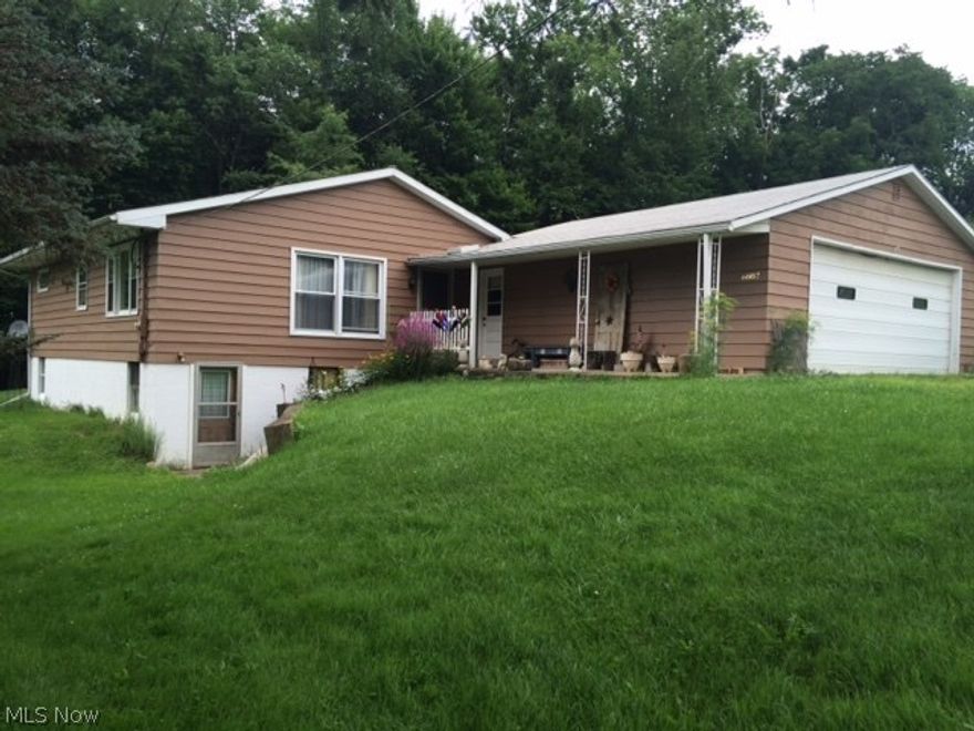 Great location - minutes from Millersburg or Berlin.  30x24 Pole Barn with barrel wood stove, elec.&water.  Hardwood floors and vaulted wood cherry ceilings throughout.  Backyard deck and attached garage.  Full walkout basement-great to entertain. Basement has a kitchen, family room and rec room.   Home does require some TLC