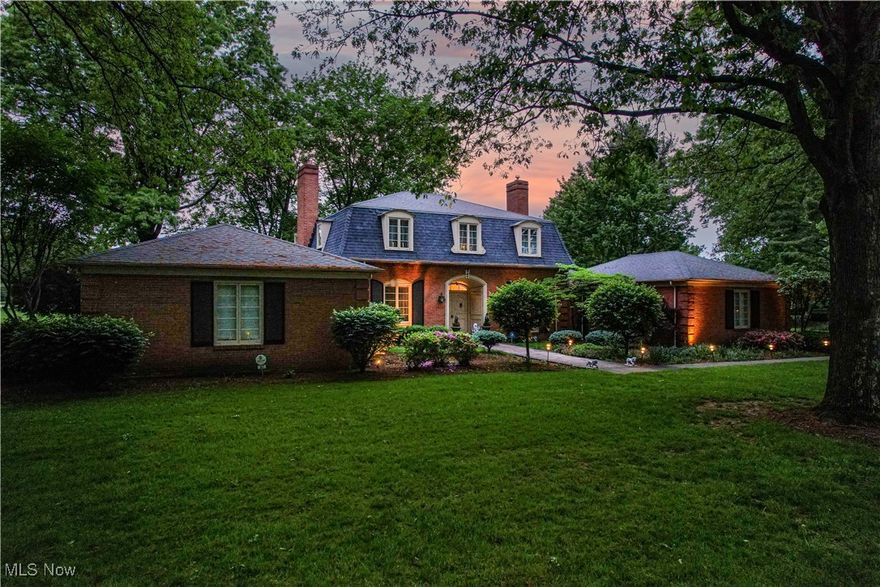 Experience refined living in this STUNNING 4-bedroom, 4.5-bath home with over 5,000 sq. ft. in sought-after Country Club Estates & Howland Schools. Enjoy BREATHTAKING golf course and pond views from nearly every room. The grand foyer with custom Finelli railing opens to a spacious living room with hardwood floors and gas fireplace. The SPECTACULAR gourmet kitchen features custom cabinetry, designer backsplash, leaded glass, center island, and ample pantry space—perfectly complemented by a formal dining room with sweeping views. The first-floor primary suite offers a spa-like bath with a floor-to-ceiling tile shower and an expansive dressing area with eight double closets. Also on the main level: a library with fireplace, two half baths, and a morning room.  Upstairs, find a guest suite with private bath, two large bedrooms, a third full bath, and a home office area. The finished lower level adds a stylish rec room with metallic epoxy floors. Step outside to a show-stopping brick patio with hot tub, built-in grill, gas firepit, and stunning outdoor vistas. Recent updates: dual furnaces & A/C units (2019), 75-gallon water heater, updated electrical, and backup sump pump. Meticulously maintained and move-in ready—luxury living at its finest.