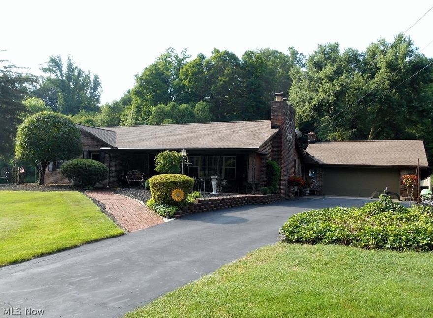 Lovingly maintained 3 bedroom, 2 bath brick ranch home on a 1.5 acre park like setting.  Home has a 2 car attached garage and a 12'X14' outbuilding with loft.  There is a beautiful front porch with a slate tile floor plus a rear patio to enjoy the views from every angle.  The updated eat in kitchen has quartz counter tops and stainless steel appliances.  The 578 Sq.Ft. bi-level 3 season florida room has a wood burning fireplace with blower, the upper level has been used as a formal dining room.  The 12'X18' living room has a gas fireplace, new carpet and custom plantation shutters. The lower level has a 11'X30' finished room with a gas fireplace and second bathroom.  Plenty of additional storage in the immaculate lower level.  $37,000 in updates since 2014.  Book your showing today.