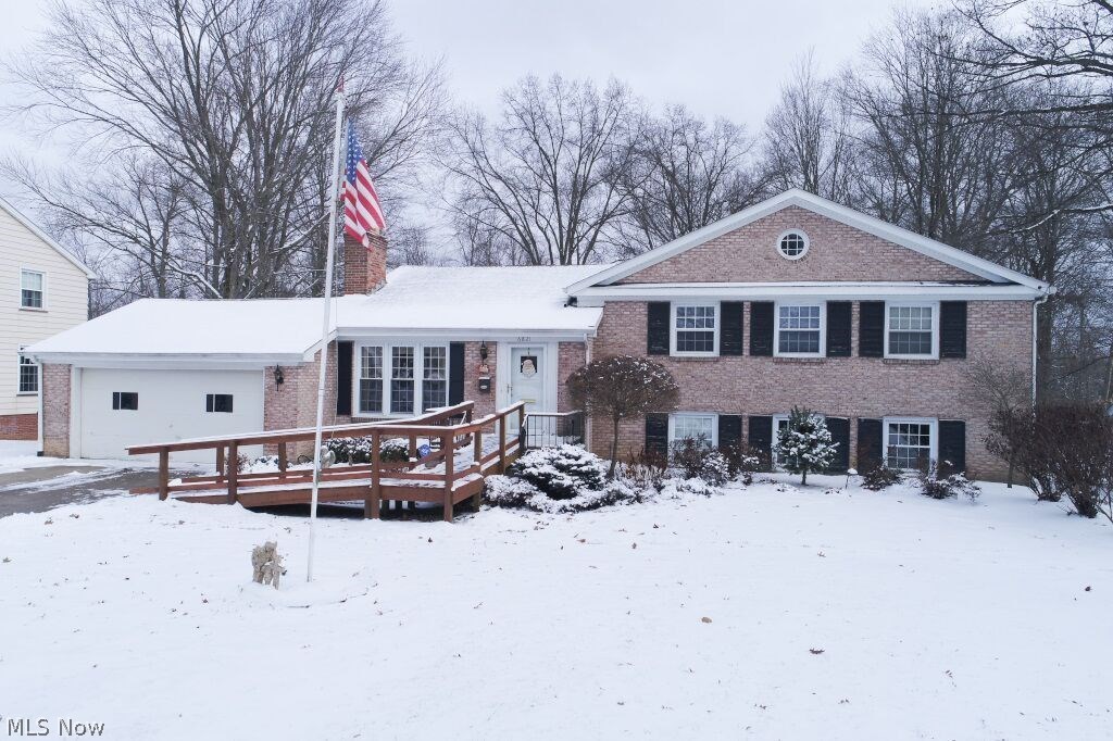 Wow, I have just listed what you have been waiting for!! Beautiful brick home, move in ready with 4 bedrooms under $200k. Let's take the tour. The curb appeal of this stately brick home in will draw you in and you won't be disappointed. As we walk in the front door you will love how the living room is open to the dining room with hardwood floors keeping the flow. The fireplace is surrounded by beautiful built in book shelves. Kitchen with granite. This home is perfect for entertaining a few steps down from the living room you have a family room with a ventless fireplace, wet-bar and a half bath also another kitchen/additional area for the family, entertaining, office..just so many possibilities. There is also a sunroom off the family room. Upstairs we will find 4 spacious bedrooms, the master with a full bath. Nice deep back yard for the kids. Newer roof, furnace, air, hwt, granite and more. This is the one!