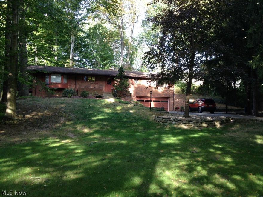 Spectacular ranch home, large beautiful great room with 2 bay windows, one with window seat, patio door to deck, built in shelving, wood flooring, opens into dining room with bay window and fireplace opens to private patio and open galley kitchen overlooking the dining room w/appliances. Master bdrm with master bathroom, one bedroom has two built in bunk beds and built in cabinet & shelves. Full basement w/laundry, den, partially finished family room with walk out. Lots and lots of storage. Small area for storage off garage. Flat barn 30x28 in back of house w/stalls, electric and water from well. A very nice view from front porch of lake that can be used to fish...This is a great property. One parcel is 110x218, the other is 146x245. HOA fee