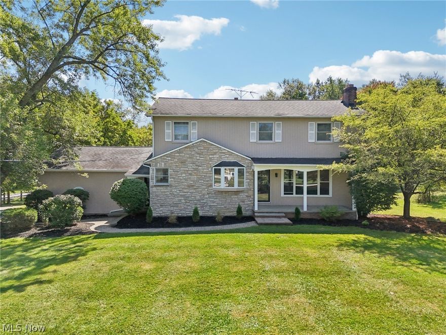 Step into modern elegance with this completely remodeled colonial. From the moment you enter, you’re greeted by a spacious living room that flows seamlessly into a stunning eat-in kitchen featuring Samsung stainless steel appliances, quartz countertops, sleek ceramic backsplash, and stylish lighting. Durable stone-core plank flooring runs throughout, tying together every detail. The main floor offers a spacious great room with sliders to brand-new composite decking, a versatile bedroom, and two fully remodeled powder rooms. Step outside to your backyard oasis, complete with a pool-ready yard and a three-season porch with its own powder room and built-in food prep station—perfect for entertaining. Please note - the pool needs both wall and liner renovation to make it functional. Upstairs, retreat to your owner’s suite with a walk-in closet featuring a custom organization system and a luxurious ensuite bath with heated floors and private balcony overlooking the pool yard. Three additional bedrooms and an updated hall bath complete the second floor. The partially finished basement is designed for relaxation and fun, boasting a fireplace, spacious bar, and beverage refrigerator—ideal for hosting friends and family. Nestled on a private corner lot, this move-in-ready home offers both style and comfort. All that’s left is for you to make it yours.