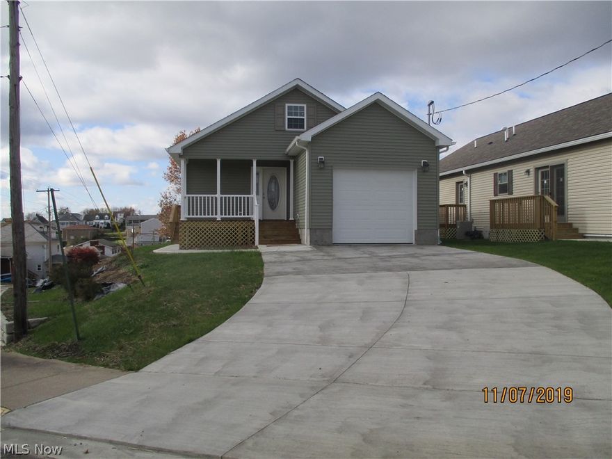 Step into this home you've dreamed of, 2 BR ranch with 2 1/2 bath.  Open floor plan.  Master bath has 4x6 tile shower, Sienna raised cabinets. Kitchen has GE gold package stainless steel.  Utility room off kitchen.  Enclosed walk up attic with floor for tons of storage.  Oversized driveway parks 6 cars.  Accessible in minutes to Pittsburgh, Wheeling and Steubenville.  Home warranty included.