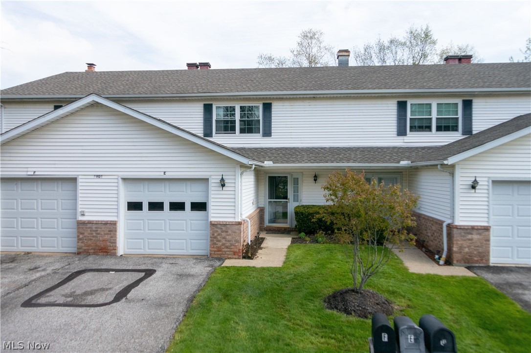 1801 Rolling Hills Dr Condo # E in Twinsburg OH 44087 is a lovely 1,519 sq ft gorgeous Condo which boasts 2 large walk in closets for EACH of the extra large bedrooms, has a full bathroom and an additional half bath and 1 car garage with newer garage door with windows! Enter the front door and you can just feel the calm and quiet I'm home feeling! Great layout with tiled entry and kitchen with great layout. This feels spacious and is spacious! Complete with new carpet from the stairs throughout both of the bedrooms! Newly painted throughout so ready to move in to at closing! To help you enjoy the fantastic view of the backyard, there is a beautiful set of sliding glass doors leading to a quite stone patio where you can relax and enjoy the nature and birds! Awesome proximity to the many different areas that include great eateries, shopping and entertainment! Easy to get to location and great locale to get to work or play! Other updates include updated electrical and installation of GFCI