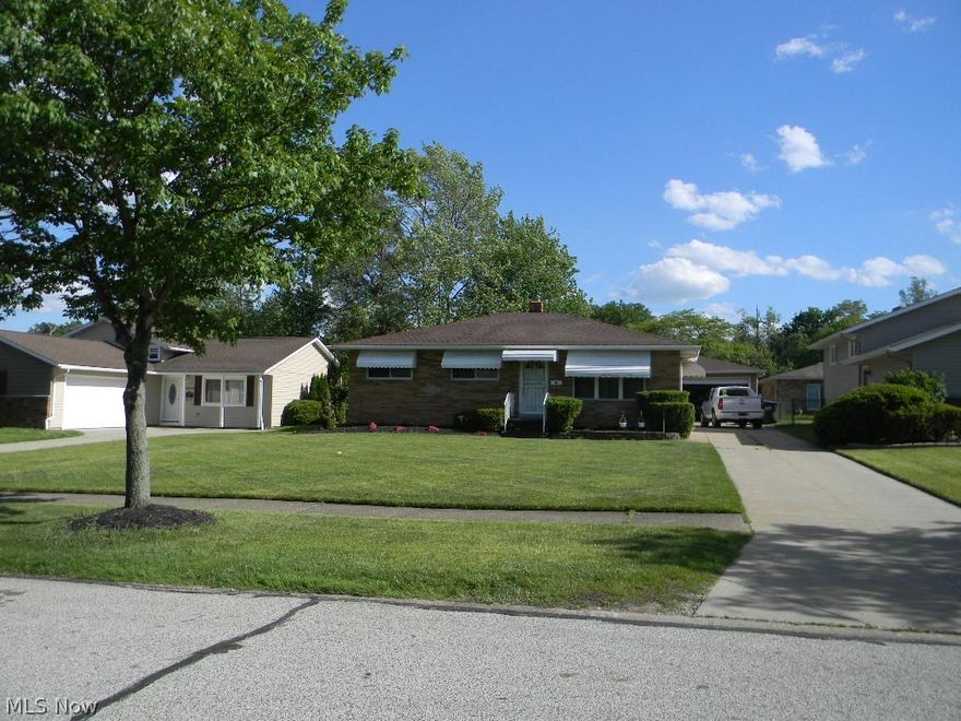 Move In Ready! Spacious Brick Range with Fantastic Updating Through. Full Finished Large Basement For Additional Living Space and or Entertainment. 
Updated Kitchen with Center Island, and a spacious Dinette access to a Wood Deck, New Cook-top,Dishwasher,Wall Oven, and Double Sing. Large Living Room with Hard wood Floors. 3-Spacious Bedrooms with Great Closet Space. Master Bedroom with 1/2 Bath. The Main Bath Room on the 1st Floor Up Dated with a Jet Tub. Fantastic Lower Level with a Bar and Full Bath.The TV In Recreation Room Lower Level Will Remain in The Home. 2.5 Car Garage. Must See to Appreciate All this Home as to Offer!!