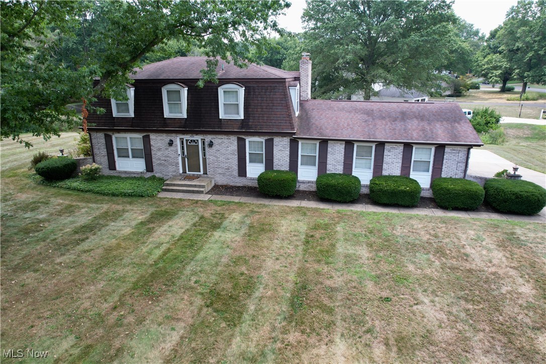 Stunning Home in Pembroke – Spacious and Well-Maintained! Nestled on a large landscaped corner lot, this all- brick home with distinctive quioned corners offers impressive curb appeal. Inside, you'll find a spacious main floor designed for comfort and convenience, featuring: A large eat-in kitchen with a breakfast bar, seamlessly connected to the cozy living area with a gas fireplace, a formal dining room and a separate formal living room – perfect for entertaining, main floor laundry and a bright, finished all-season sunroom, a convenient 1/2 bath and a private office with custom cherry cabinets. The lower level includes a finished rec room with counters and a sink, ideal for hosting guests or relaxing with family. Upstairs, the home boasts 4 generous bedrooms and 2 full bathrooms, with ample closet space throughout. The exterior is equally impressive, with a new stamped concrete patio and a beautiful hardtop gazebo, perfect for outdoor relaxation. Additional features include a 2-car attached garage and extra parking in the driveway. Located in a quiet neighborhood yet very close to local shops and amenities, this home offers the best of both worlds – peaceful living with easy access to everything you need. Don’t miss out on this incredible opportunity. Schedule your tour today!