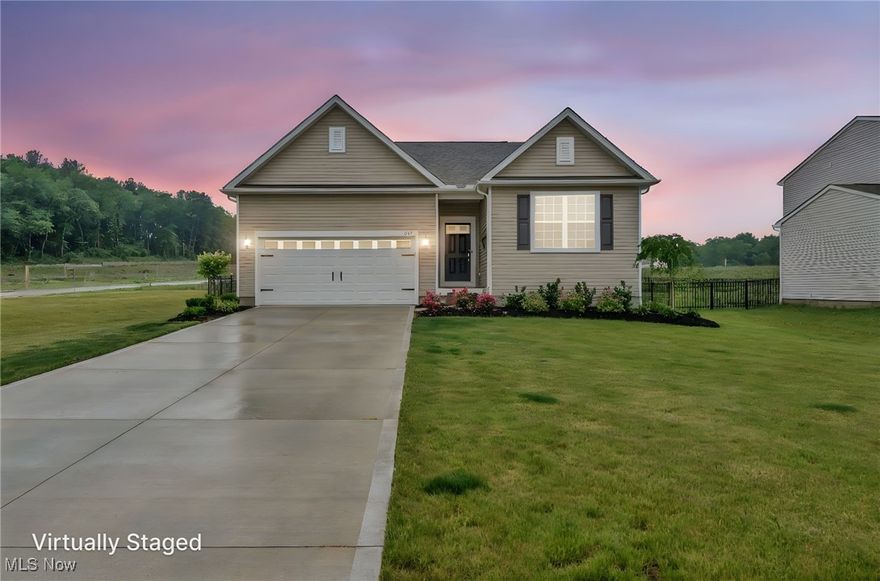 Newly built, move-in ready Ranch with many upgrades located on over .34 of an acre fenced-in property in the Mount Eaton Estates community just minutes to charming downtown Wadsworth. This thoughtfully designed home features an open floor plan with stunning kitchen with quartz countertops, tiled backsplash, upgraded cabinetry, and large island with ALL kitchen appliances included. The owners' suite has a walk-in closet and en-suite bath with double vanity and walk-in shower. Other highlights include a 1st-floor laundry room, attached 2-car garage, full basement with 9-ft ceiling and rough-in plumbing for a full bath, and a full fenced-in yard with irrigation system already installed. In addition to many builder upgrades, such as quartz countertops in the kitchen, LVP flooring, upgraded appliances and refrigerator, ceiling fans, crown molding, wainscoting, and much more, since moving in a fence was installed, Ring doorbell, and window treatments throughout. INCLUDED are kitchen appliances, the Ring doorbell, and all window treatments. Conveniently located near I-76, OH-57, shopping, restaurants, and many other local attractions. This home is a must see!