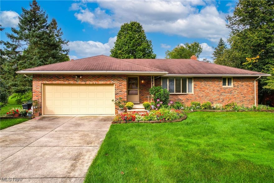 **OPEN HOUSE SATURDAY 9/30 12-2PM**Charming Ranch-Style Retreat on a Quiet Dead-End in North Royalton**
Situated at the peaceful end of a dead-end street, this 3-bedroom, 2.5-bath brick ranch home offers both privacy and charm in North Royalton's heart. The kitchen, modern and bright, showcases white cabinets, granite countertops, a spacious center island, and durable ceramic tile flooring. An adjacent eat-in area features a sliding door, leading directly to the back deck.

Hallways and bedrooms boast pristine hardwood floors. The main living room, filled with natural light, contrasts perfectly with the family room's cozy wood-burning fireplace. The 3-season sunroom, an added bonus, flows seamlessly onto the spacious back deck, revealing views of a verdant yard and the tranquil woods beyond.

Modernized bathrooms bring contemporary comfort, and the lower level unveils a recreational room equipped with a wet bar, a versatile room, full bath, and a bonus space with a secondary kitch