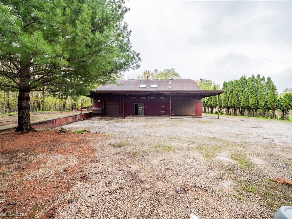 Situated on 1.37 acres, overlooking the Vermilion River Valley and Mill Hollow Reservation, this workshop, barndominum, or makerspace is awaiting your finishing touches! Perched above the river and adjacent to 100’s of acres of Metropark land you will have beautiful views and tons of wildlife at your back door. The 2,880 Sq Ft ground floor of the structure is constructed of sturdy poured concrete walls. The first workshop area is 47 Ft x 18.5 Ft with a ceiling height of 12 Ft and bay door measuring 9.5 Ft x 11 with concrete flooring. This space houses the 220v air compressor, 2 chain lifts, fuel oil furnace that is ducted throughout most of the building. In addition to the fuel oil, a large wood burning furnace is also ducted into the same system. There is an additional unpaved garage area with a 8.5 Ft x 8 Ft bay door and 12ft ceiling. The rest of the ground level is shop and storage space with concrete floors, ample lighting, and a half bath with laundry. The second floor is an open,