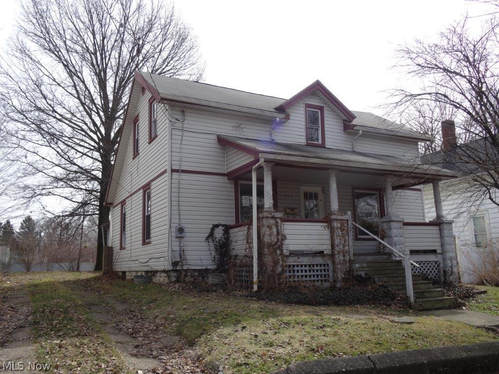 Great price close to downtown Ravenna - great potential, will not last at this price! 2 car + car garages, needs TLC.