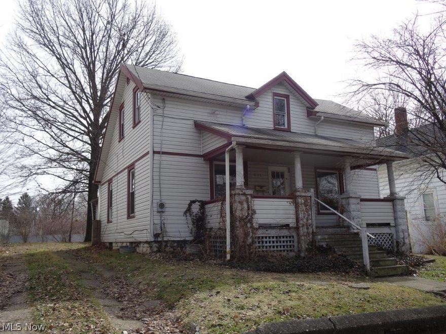 Great price close to downtown Ravenna - great potential, will not last at this price!  2 car +  car garages, needs TLC.