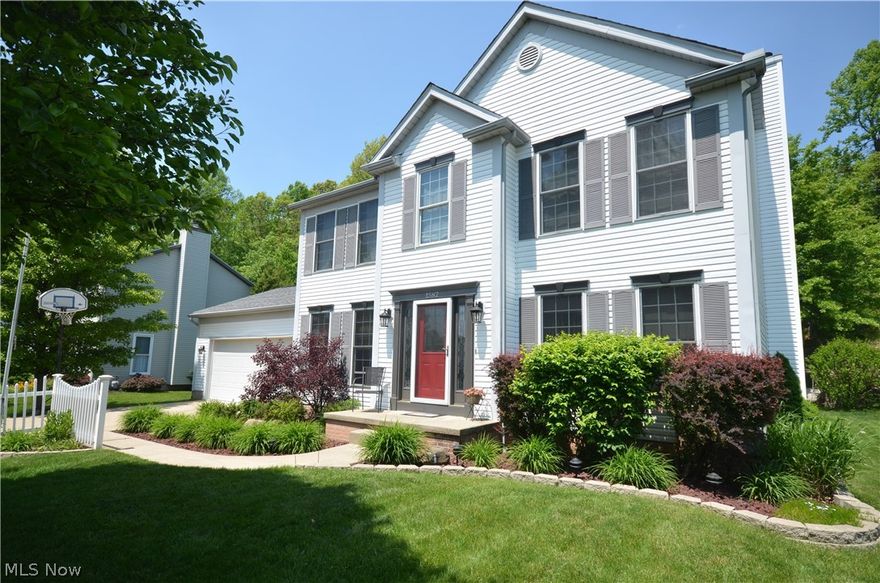 Immaculate Tallmadge Hills 4 bd, giant finished basement, private views out back – Quality built by Dutch Heritage w woodwork, pillars, Pella Windows, steel beam bsmt plus upgrades of granite & more! Big deck w remote control awning, trellis hot tub area & paver patio. Hardwood foyer w open spindle staircase flanked by office & formal dining rm w chair rail. Open layout- great rm w fluted wood pillars, crown molding & gorgeous gas fireplace w mantle. Eating area w slider to deck- tile floor into updated kitchen w center island, granite counters, tile backsplash, raised panel cabinets, pantry closet & lazy susan! 1st flr ½ bth w tile floors & granite counter plus 1st flr laundry w tile floor & cabinets. Master suite w cathedral ceiling & sitting area- glam master bth w giant 2 sink vanity plus make up area, garden tub, shower & walk in closet. Addtl bdrms plus full bth w slate floor & shower/tub complete 2nd flr. Must see finished basement! Tons of beautiful built ins w crown molding &