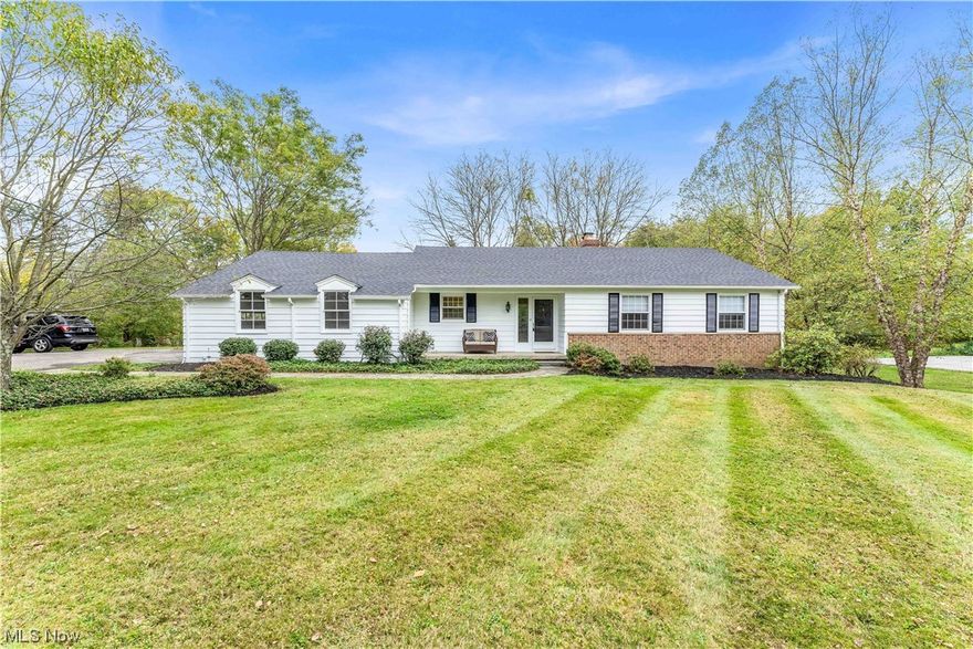 Welcome to this inviting, freshly painted aluminum-sided ranch situated on a sprawling 1-acre lot. The finished basement with walkout to the backyard adds valuable space and versatility to the home. With a completely remodeled interior, you'll enjoy a modern and stylish living environment.  The recent upgrades include a new roof, new gutters, and a new garage pad. The 2-car attached garage offers convenient parking and storage options. The heart of this home is the beautifully remodeled kitchen featuring Quartz premium counters on white shaker soft-close cabinets and a stylish gray glass tile backsplash. This kitchen is sure to be a hub of culinary creativity and gathering.
