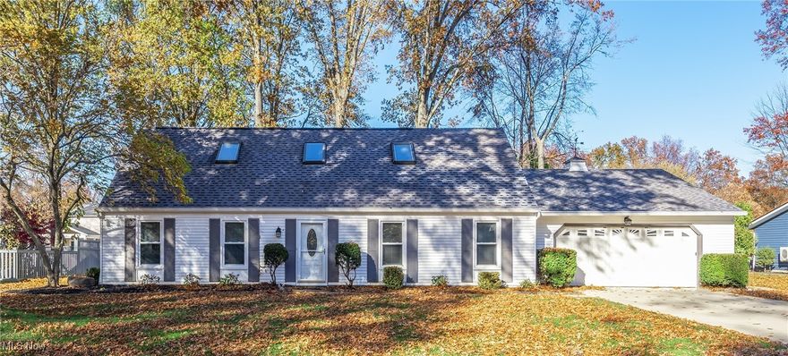 Don’t miss this spacious Avon Lake gem offering rare first-floor bedrooms, baths, and laundry!
A huge, uniquely enclosed, living room could be the perfect media room or recreation space—complete with a bar and beverage fridge. The inviting family room with a wood-burning fireplace flows seamlessly into the updated kitchen, showcasing a granite island, sleek stainless appliances, and plenty of prep space.

The bright Morning Room opens to the patio and offers endless versatility—use as a sun-filled dining area, cozy lounge, office, pet space, or anything you imagine. Durable indoor/outdoor carpet covers ceramic tile, matching the kitchen and half bath. Convenient first-floor laundry, half bath, and garage access round out this wing of the home.

The main level also includes two comfortable size bedrooms with newer carpet and ceiling fans, plus a beautifully updated full bath. Upstairs, you’ll find two generously sized bedrooms (both wired for Ethernet) and a second full bath. One bedroom includes access to a large storage closet with the furnace and a handy panel that leads directly to the garage attic storage.

The spacious 2-car garage offers ample shelving and cabinetry. The .36-acre lot extends beyond the fenced area to the treeline, with wood fencing enclosing the patio and a portion of the backyard for privacy and peace of mind.

Almost the entire home has been refreshed recently: new kitchen cabinetry and granite counters, new bath fixtures, appliances under 5 years, Morning Room windows under 8 years, other windows newer, AC & furnace (2016), hot water tank (2012), roof tear-off (2010), plus updated flooring and lighting throughout.

Move-in ready, wonderfully updated, and packed with flexible living spaces—this home truly has it all!