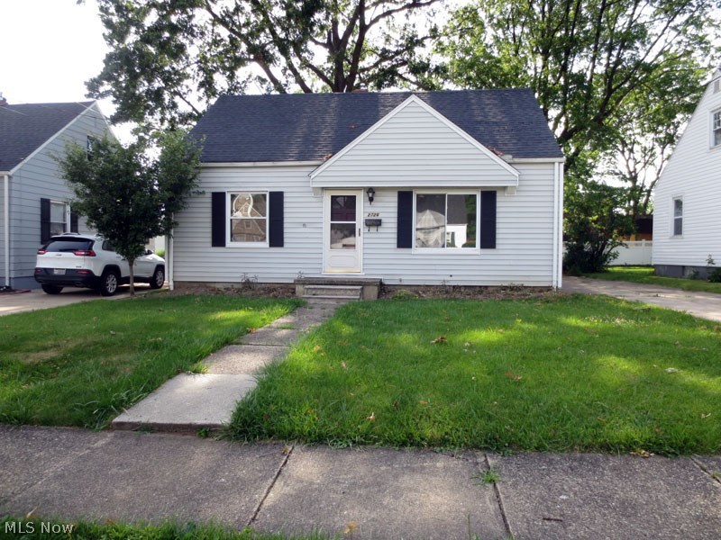 This is a great cape cod in a wonderful neighborhood, close to everything in the Falls. Maintenance free vinyl siding, vinyl replacement windows, Basement has been both waterproofed and walls stabilized with beams. Entire interior freshly painted in fashion neutrals, including kitchen cabinets. Cabinets have new hardware and countertops and kitchen flooring & carpet on the 1st floor are brand new! Under carpet is hardwood oak flooring. Also just added is a new side storm door, new front shutter. Enjoy Cuyahoga Falls utilities and amenities and much more.